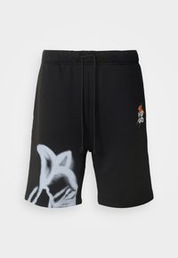 Shorts noirs avec une taille à cordon de serrage, présentant un motif graphique gris sur une jambe et un petit logo brodé de l'autre côté.