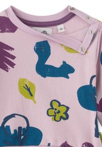 Light pink long-sleeve shirt featuring a squirrel design and various colorful shapes, with snap closures at the shoulder and soft fabric texture.