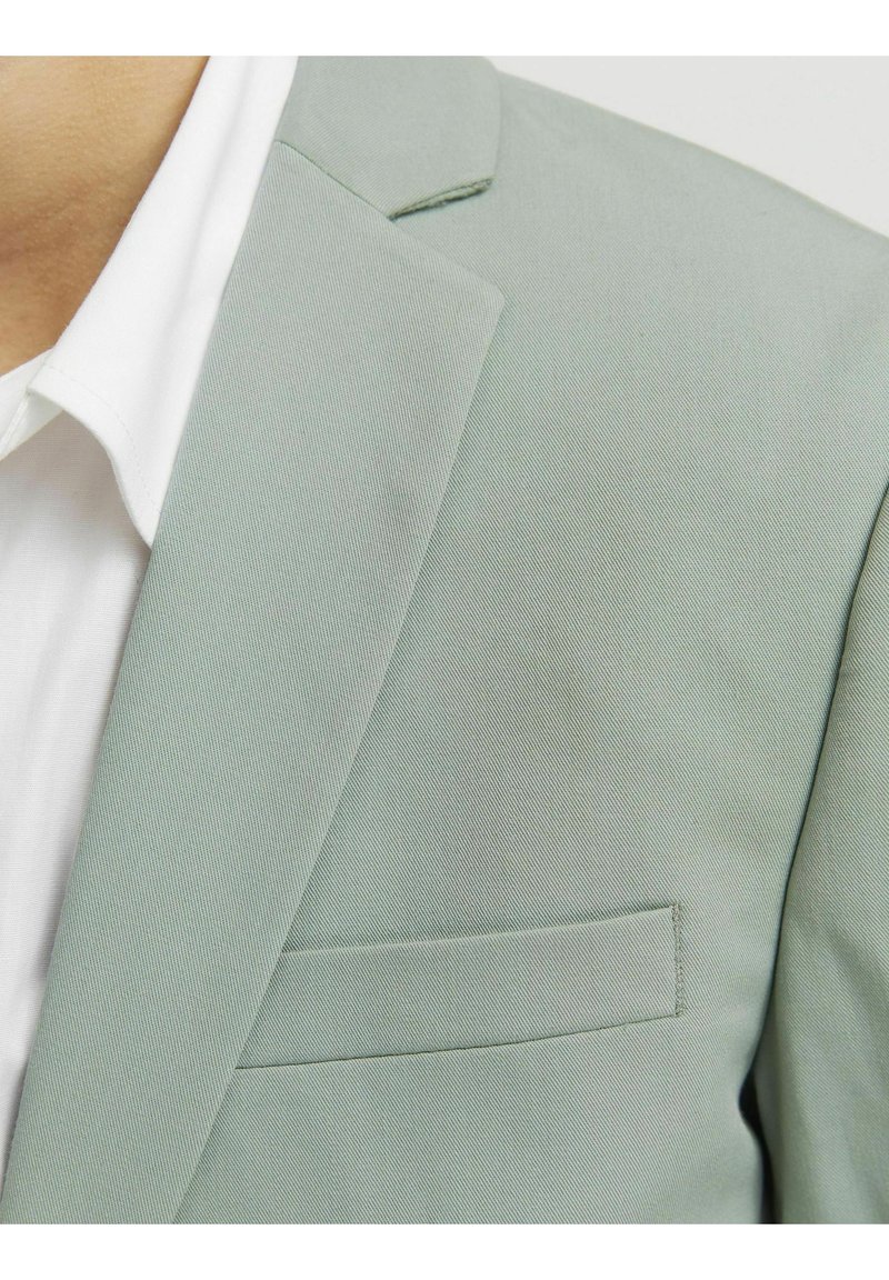 Veste CHANEL tweed vert et gris T38 : occasion certifiée authentique