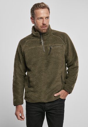 Fleece pullover in olive green, featuring a high collar, zippered chest pocket, and two side pockets. Soft, textured fabric.