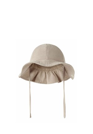 Beige soft fabric bucket hat with wide, floppy brim and adjustable chin straps, designed for sun protection.