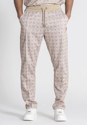 Lichtroze joggingbroek met een overal grafisch patroon, een elastische tailleband met koord, zijzakken en extra smalle enkels.