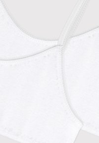 Λευκό βαμβακερό σουτιέν με απαλή, υφή επιφάνεια, που διαθέτει διακριτικό σχεδιασμό με σταυρωτό πίσω μέρος και λεπτές, λείες τιράντες με ραφές που συγκεντρώνονται.