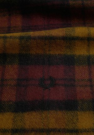 Tessuto a quadri nei colori bordeaux, giallo senape e nero con un piccolo emblema di alloro ricamato in nero al centro.