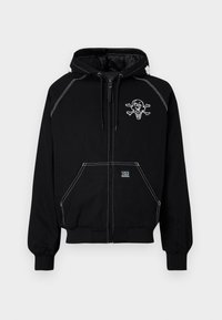 Black zip-up hoodie made of cotton, featuring white stitching, front pockets, and a graphic of a skull with crossbones and an ice cream cone.