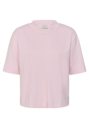Camiseta recortada de manga corta, cuello redondo y color rosa claro, con un ajuste holgado y una pequeña etiqueta de la marca dentro del cuello.