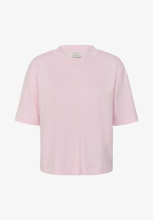 Camiseta recortada de manga corta, cuello redondo y color rosa claro, con un ajuste holgado y una pequeña etiqueta de la marca dentro del cuello.