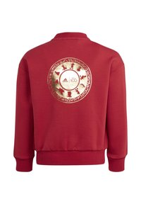 Czerwona bluza z okrągłym złotym wzorem na plecach, zawierającym loga Disney i Adidas, prezentującym charakterystyczne sylwetki postaci.