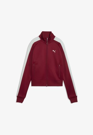 Tumepruun pikk tõmblukuga jakk valgete triipudega varrastel, kõrge krae, tõmblukuga taskud ja väike Puma logo rinnal.