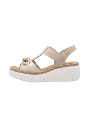 Platform sandals with a gold metallic leather upper, woven jute detailing, and a chunky white rubber sole. Features an elastic strap for support.