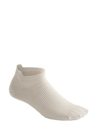 Beige ankellång strumpa gjord avstickad tyg, med en texturerad design och förstärkt häl och tå för ökad hållbarhet.