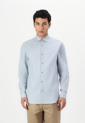 Light blue striped button-up shirt with long sleeves, featuring a point collar and a straight hem. Buttons and subtle texture add detail.