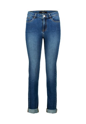 Jean skinny bleu en denim, avec une taille haute, cinq poches et des revers retroussés. Coutures traditionnelles et fermeture avant par bouton.