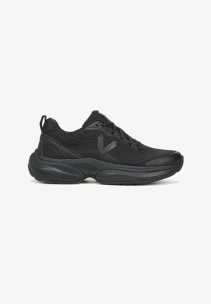 Black athletic shoe featuring a mesh upper, textured design, cushioning sole, and reinforced toe. Laces and pull tab included.