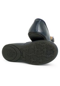 Blue leather shoe with a rounded toe and medium heel. The sole features a floral pattern and a rounded logo. Flat black outsole.