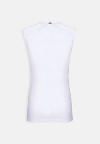 Vit ärmlös topp med en figurnära design, tillverkad av ett slätt material. Har axelaccenter och sidopaneler för flexibilitet.