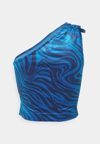 Haut asymétrique bleu et marine avec des rayures ondulées semblables à celles d'un zèbre et un petit détail de nœud froncé à l'épaule.