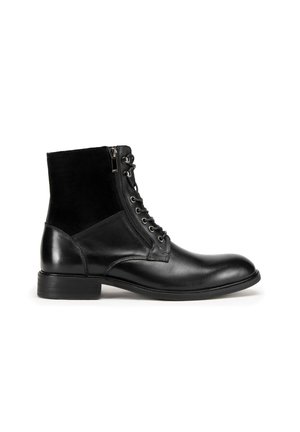 Black leather ankle boots with a smooth finish, lace-up front, side zipper, and a textured fabric panel above the heel. Low block heel.
