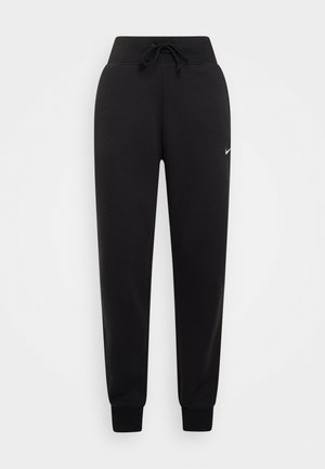 Juodos sportinės kelnės, pagamintos iš minkštos medžiagos, su raišteliu juosmens srityje, raukšlėtu apačiu ir mažu auksiniu „Nike“ logotipu kairėje pusėje.