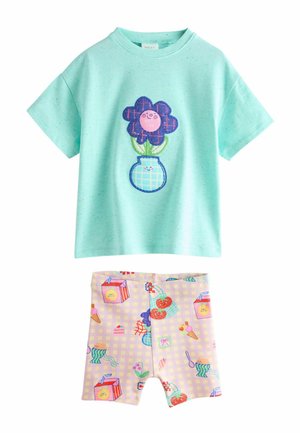 Short-sleeve mint green toddler shirt with happy flower in vase graphic, paired with pastel shorts featuring colorful food and drink patterns.