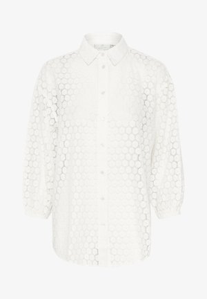 Balta nėriniuota palaidinė su apykakle, sagų uždarymu, burbulinėmis rankovėmis ir apvalia gėlių raštu visame paviršiuje.