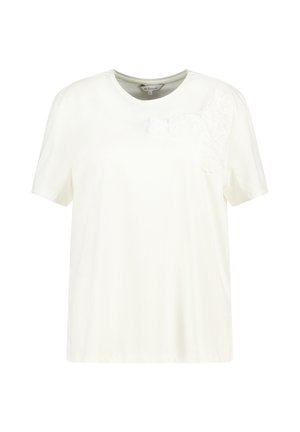 Witte T-shirt met korte mouwen, gemaakt van zachte stof, met een bloemig ontwerp in textuurstof op de linkerschouder. Ronde halslijn.