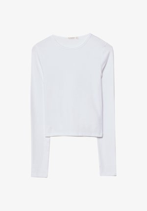 Witte lange mouw crop top, gemaakt van zachte katoen, met een ronde halslijn en een aansluitend ontwerp met minimale naden en zonder versieringen.