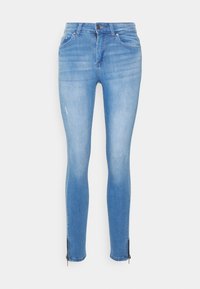 Svetle modré skinny džíny vyrobené z denimové látky s hladkou strukturou, s detaily zipu na lemu a jemným vyblednutím na stehnech.