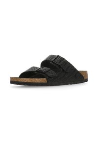 Sandalo scivoloso nero intrecciato con due cinturini superiori, plantare in sughero e suola in gomma texturizzata. Caratterizzato da cinturini regolabili per una vestibilità ottimale.