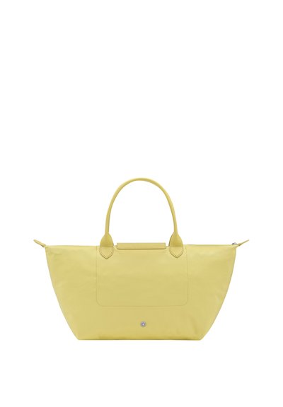 Yellow tote bag with zipper closure, two handles, and a small front snap button pocket, shown on a white background.