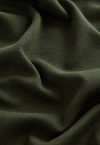 Dark olive green fabric, softly draped with a smooth texture, featuring a subtle stretch and fine weave, creating a flowing appearance.