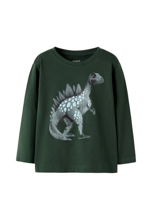 Ciemnozielona koszulka z długim rękawem z szarą grafiką dinozaura stegozaura z białymi plamami na środku z przodu.