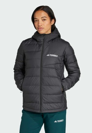 Black puffer jacket with a hood, features quilted texture, zip closure, and front pockets. Logo displayed on the chest.