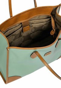 Grande borsa tote in pelle azzurro chiaro con accenti in pelle beige, dotata di un ampio interno, scomparti e una finitura liscia.