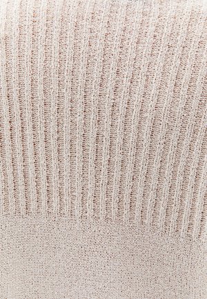 Jasno beżowa, prążkowana dzianina o miękkiej fakturze. Projekt charakteryzuje się naprzemiennymi pionowymi pasami oraz gładką dolną częścią.