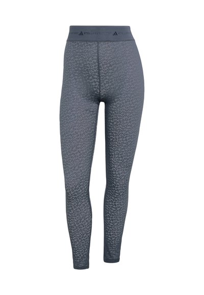 Gray leopard print leggings made from textured fabric, featuring an elastic waistband with branding. Form-fitting and smooth finish.