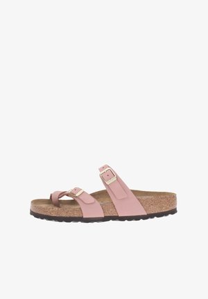Pink two-strap sandal with adjustable metal buckles, cork footbed, and rubber sole, featuring a simple, minimalist design.