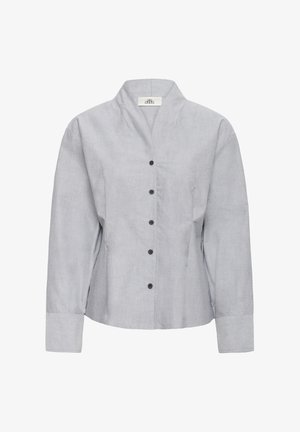 Helehall pikad varrukad nööpidega särk V-kaelusega, mustade nööpidega esiosas, esitatud valgel taustal.