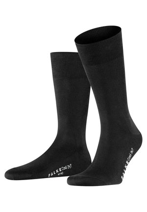 Schwarze Socken mit glatter Textur, in knöchelhöhe, verstärkter Zehenpartie und elastischem Bund. Markenlogo und Modellname in Weiß aufgedruckt.