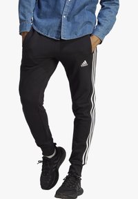 adidas Sportswear - ESSENTIALS FRENCH TERRY TAPERED CUFF 3 STRIPES PANTS - Tracksuit bottoms - schwarz Thumbnail Image 1