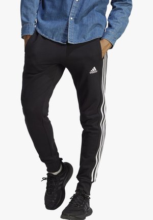 ESSENTIALS TAPERED CUFFED 3-STRIPES - Tracksuit bottoms - schwarz