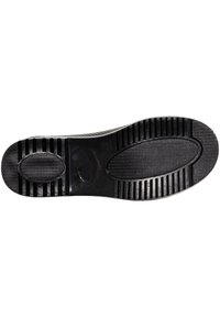 Black rubber shoe sole featuring a textured surface, distinct patterns, and ridged edges for enhanced grip and durability.