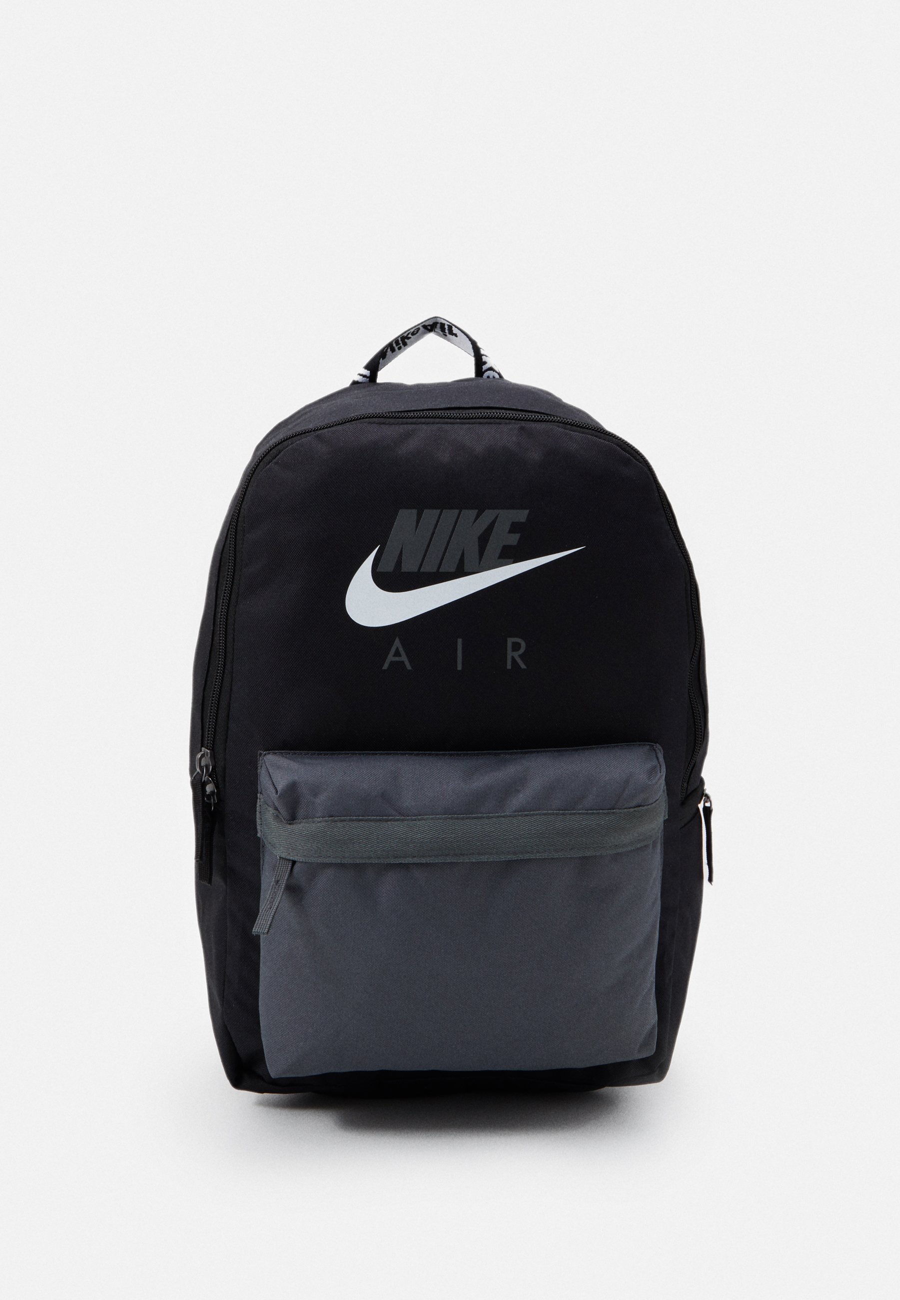 grey and black nike backpack