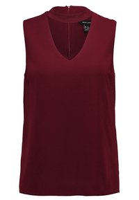 Burgundy ärmlös blus med V-ringning och hög krage. Slät tyg med bakre dragkedjestängning och avslappnad passform.