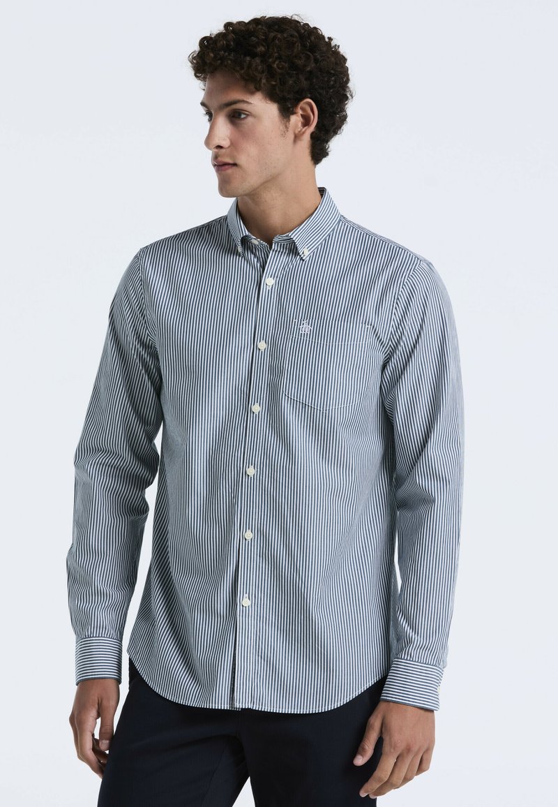 Overhemd met knopen in marineblauw en witte strepen, met een opstaande kraag, lange mouwen en een borstzak met logo-borduring.