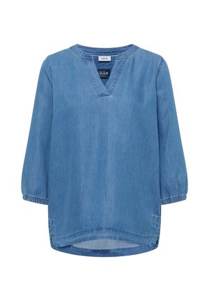 Túnica vaquera azul claro con mangas elásticas tres cuartos, escote en V con abertura y dobladillo ligeramente redondeado.