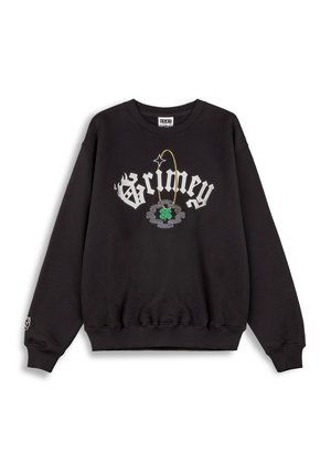 Sudadera negra de cuello redondo con "Grimey" en script blanco, que cuenta con un bordado colorido de un trébol de cuatro hojas y detalles de acento. Textura suave.