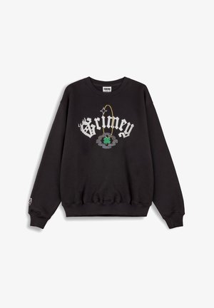 Sudadera negra de cuello redondo con "Grimey" en script blanco, que cuenta con un bordado colorido de un trébol de cuatro hojas y detalles de acento. Textura suave.