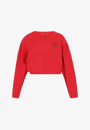 Czerwony skrócony sweter z bawełny z okrągłym dekoltem, opuszczonymi ramionami i emblematem w kształcie serca z łapką na klatce piersiowej. Ribbowane mankiety.