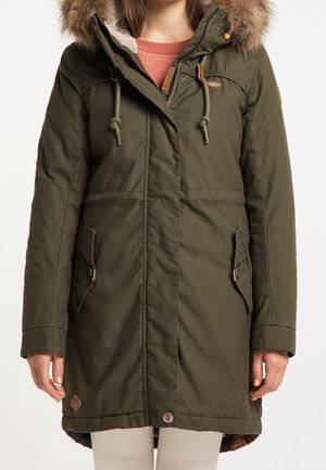 Olive green parka with a faux fur hood, two front pockets, drawstring at the waist, and a zipper closure with branded accents.